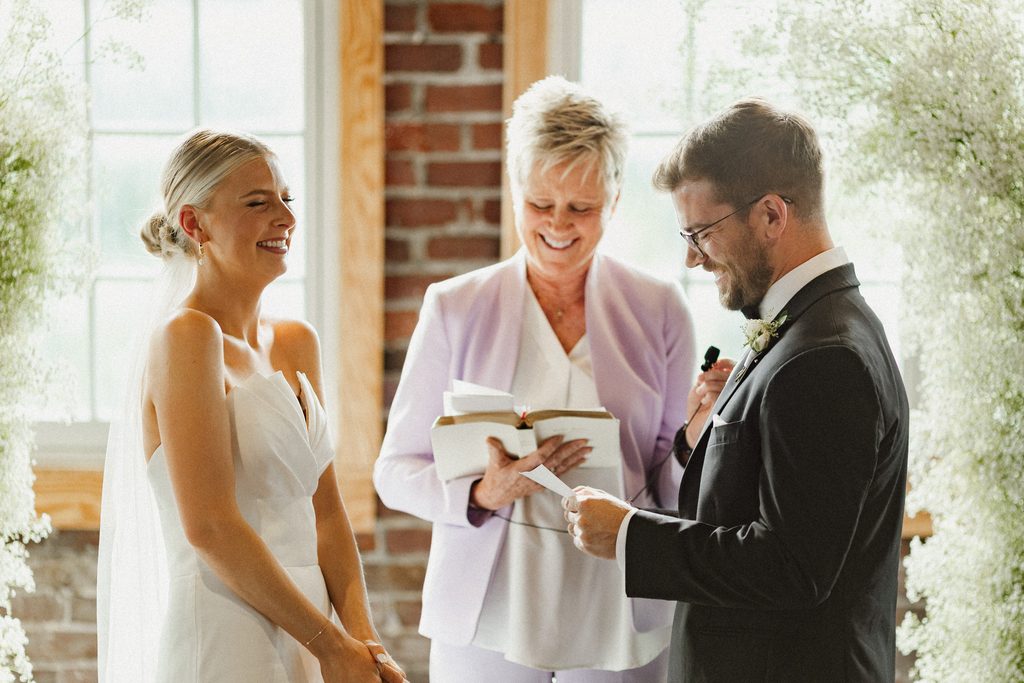 Bride and groom exchanging vows during their intimate Tinker House Events wedding ceremony.