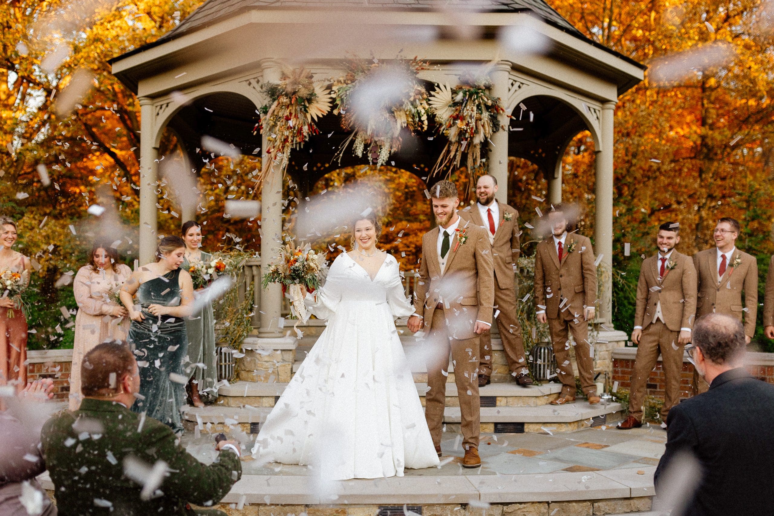 Audra and Gannan celebrating their vintage-inspired estate wedding at a private family home in Auburn, Indiana.